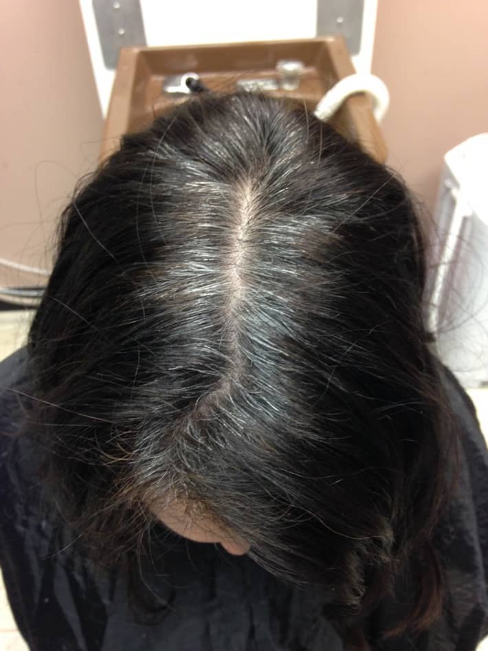an image of my hair before using hairprint where my gray roots are showing