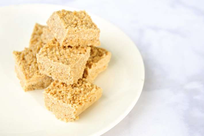 puffed quinoa tahini bars stacked on a plate as a healthier substitute for rice crispy treats