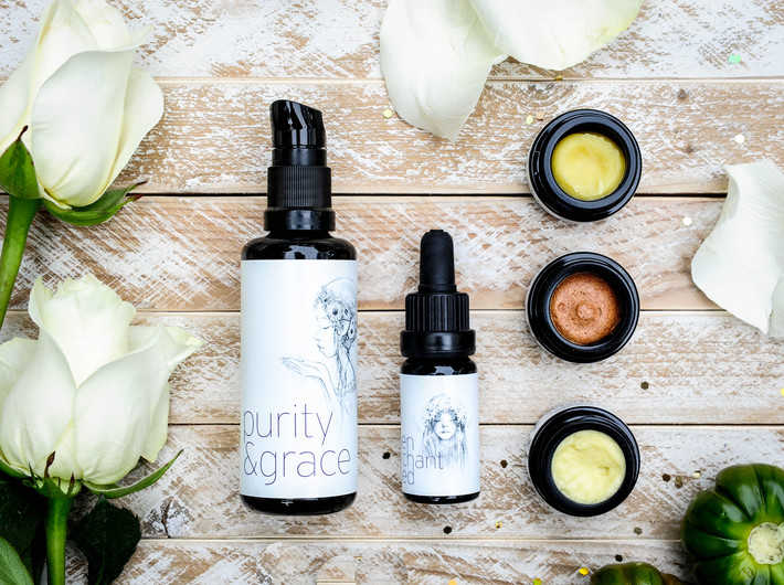 max and me skincare styled on a wooden background with white roses and green gourds 