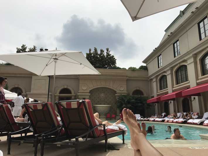 lounging at the pool at the st regis atlanta on a cloudy day