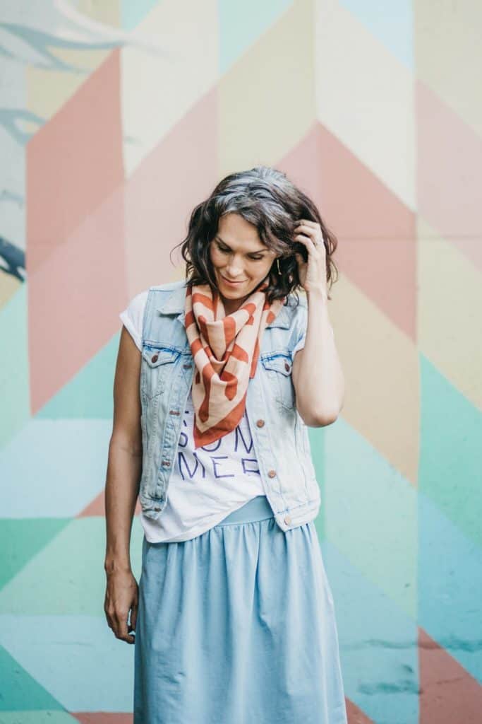 Mara Vera handmade scarf tied around my neck and paired with a light jean vest 