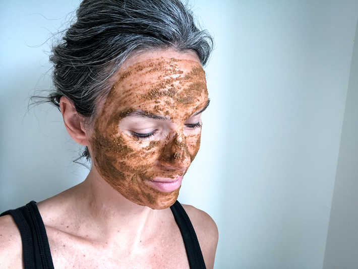 Laurel Brighten Mask is a brown gritty mask applied here