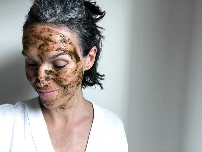 Josh Rosebrook's Active Enzyme Exfoliator is a dark brown gritty mask applied here
