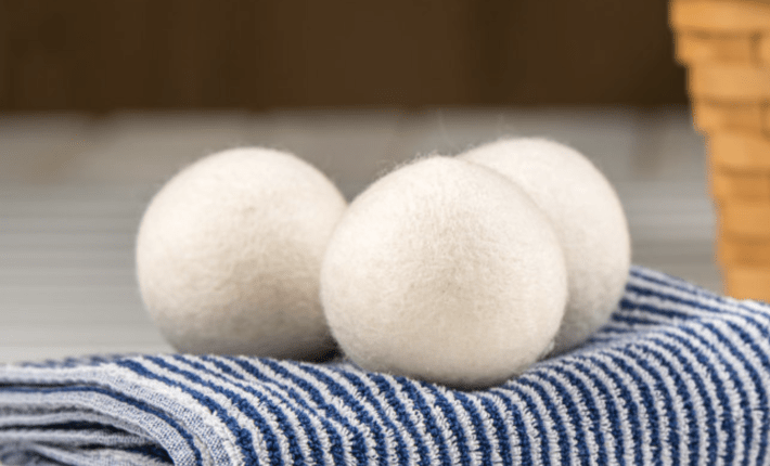 three dryer balls styled on a towel