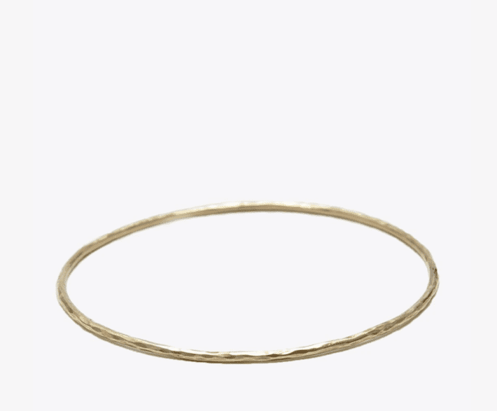 gold bangle on a white background