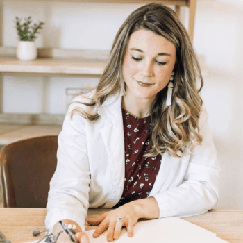 Kristin Oja, doctor of nursing, writing orders of how to support immune system naturally