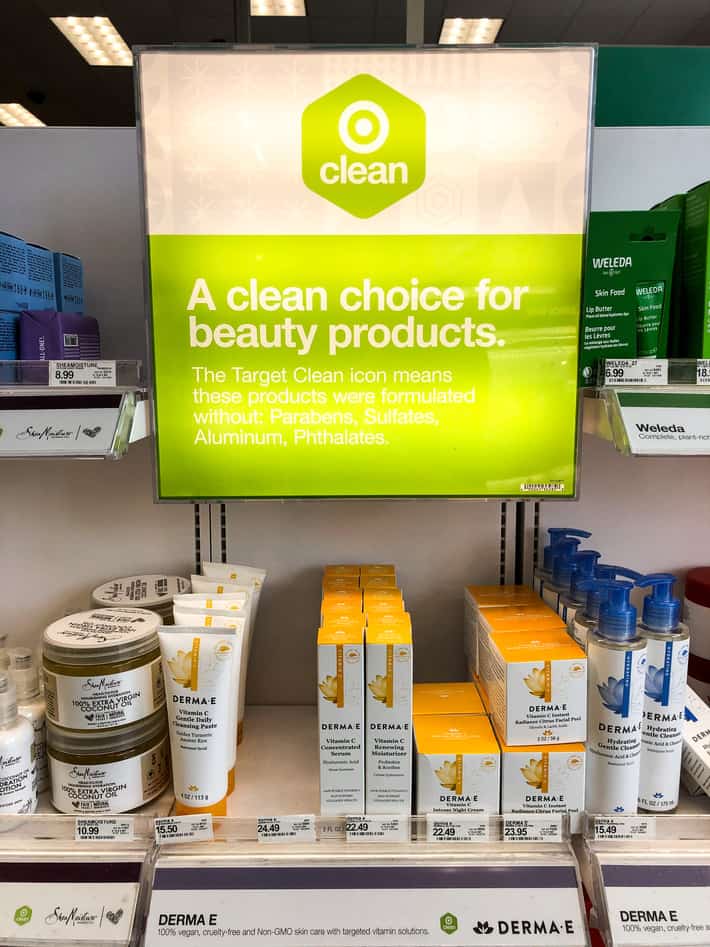 the clean at target green sign hanging in a Target store amongst clean products