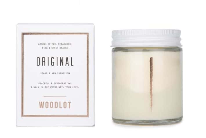 Woodlot Candle placed next to its packaging