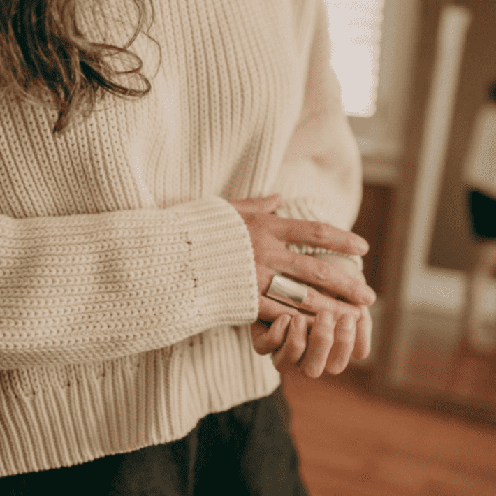 lisa wearing a white tradlands sweater