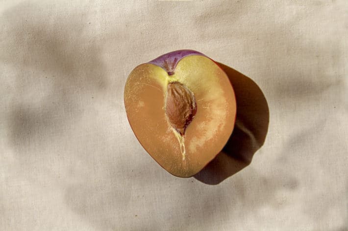 Half plum on nude background