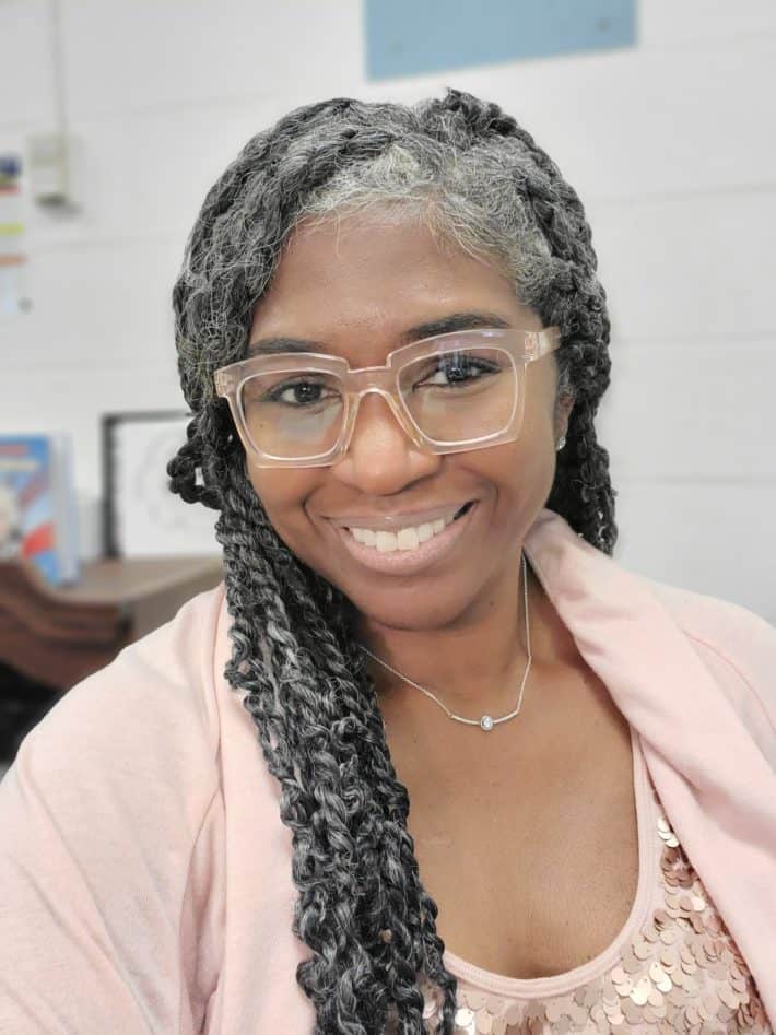 Black woman with gray hair extensions