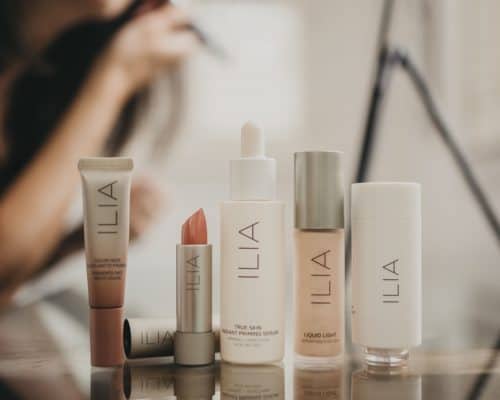 woman trying Ilia makeup products