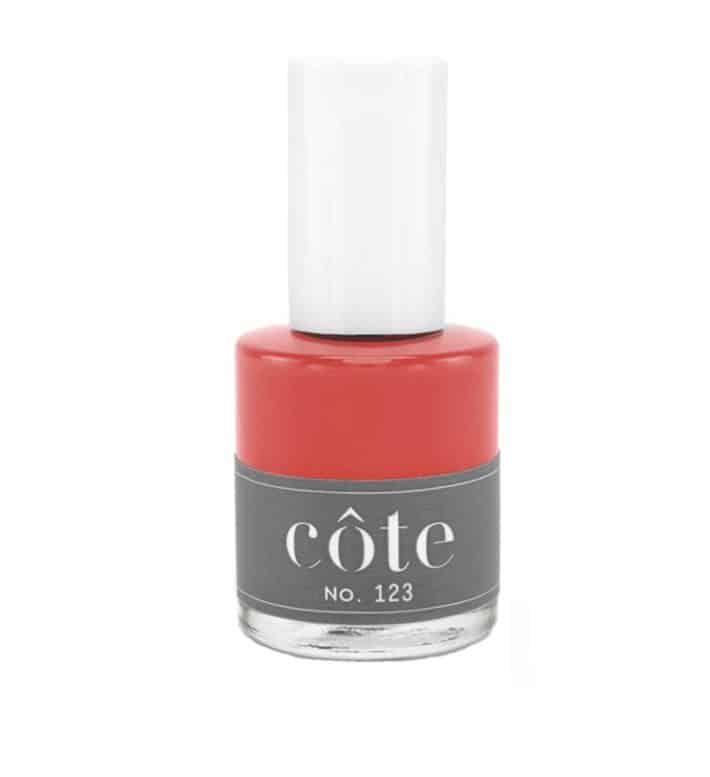 Nail polish Bottle of vibrant red color from Côte