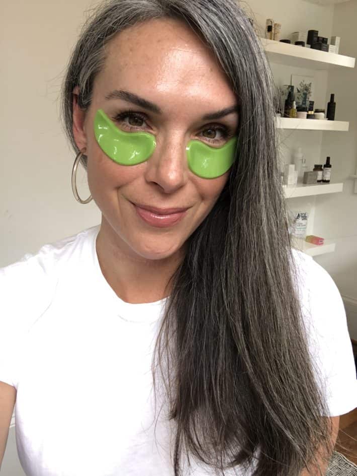 a woman wearing green eye masks