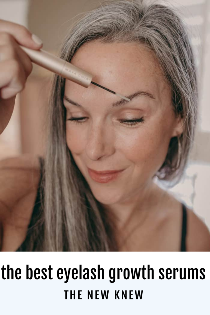 A woman applies eyebrow growth serum.