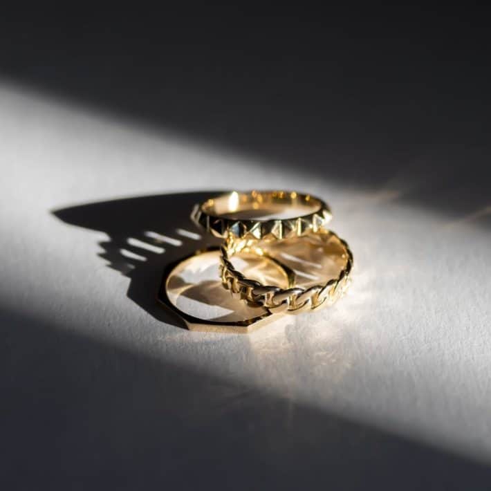 a set of two gold rings made with sustainable materials
