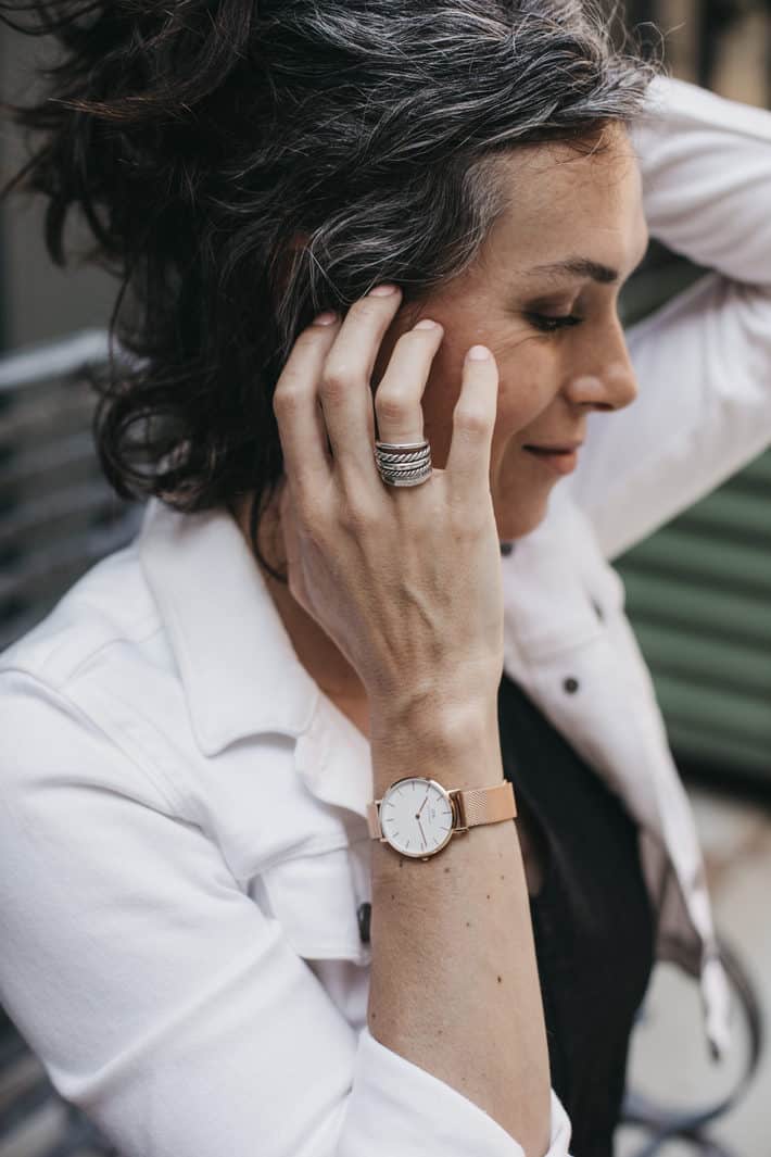 woman wearing watch and bracelet from sustainable jewelry brand