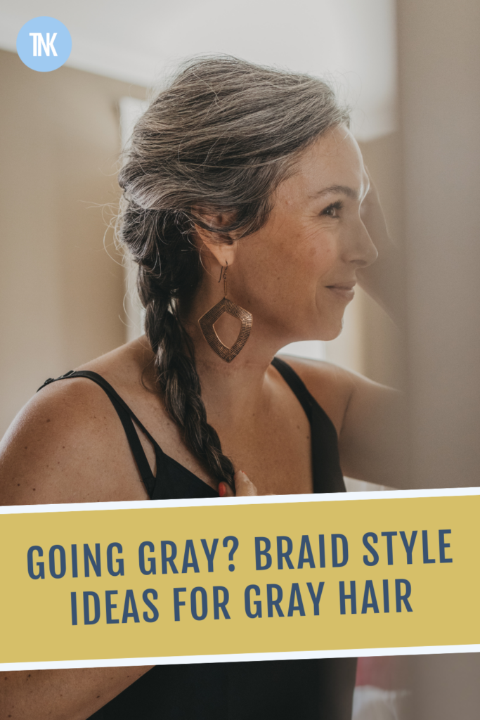 A woman with gray braided hair.