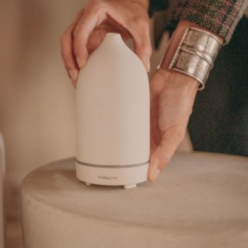 Woman holding diffuser for home