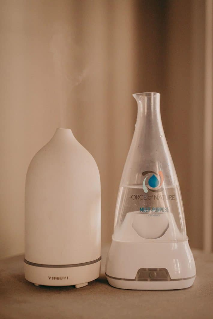 A room diffuser and a glass bottle from Force of Nature