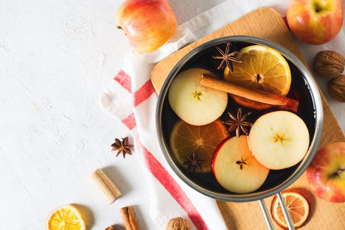 A pot with fruits and cinnamon for scented rooms