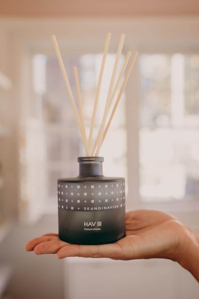 Woman holding an organic room diffuser