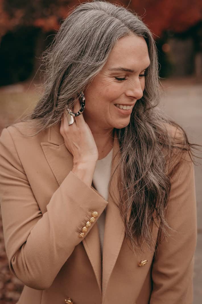 woman with gray long hair smiling