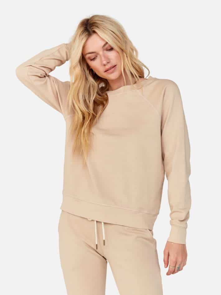 a sand colored sweat shirt and joggers 
