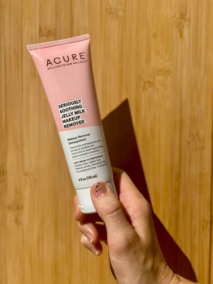 holding the acure jelly cleanser 