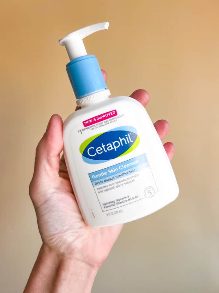 a hand holding bottle of cetaphil gentle skin cleanser