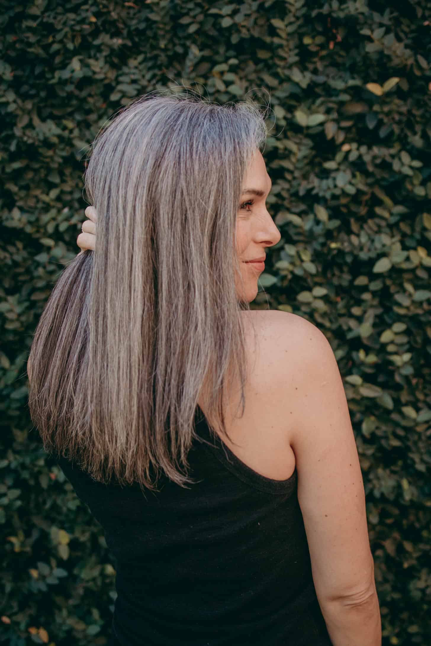 Lisa looking off the side with sleek gray hair.