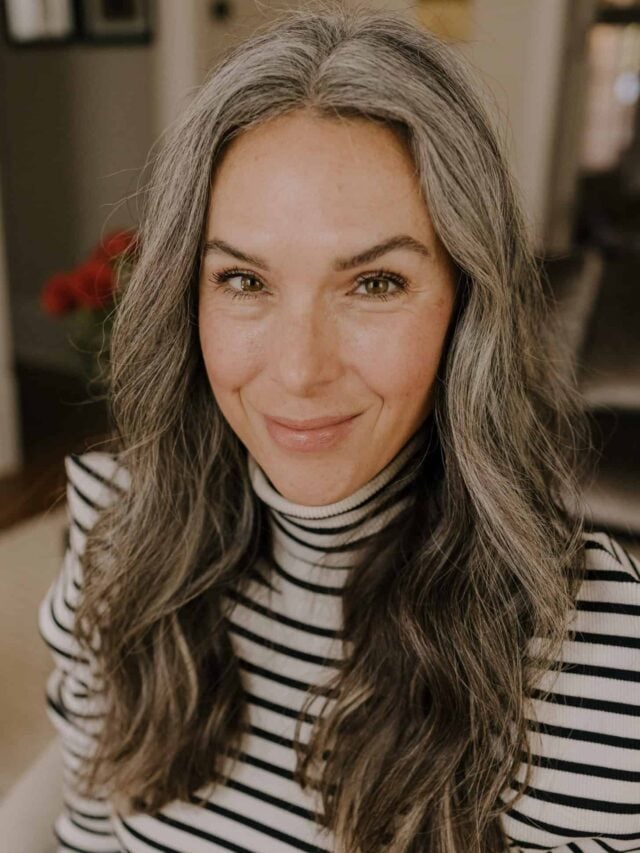 A woman with gray hair extensions.