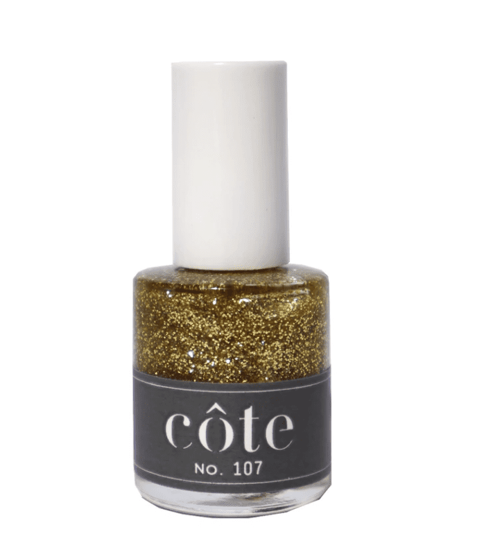 a bottle of cote brand nail polish in metallic gold