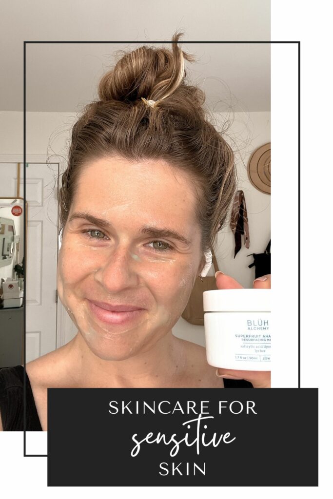 a woman holds up a tub of resurfacing mask by BLUH Alchemy