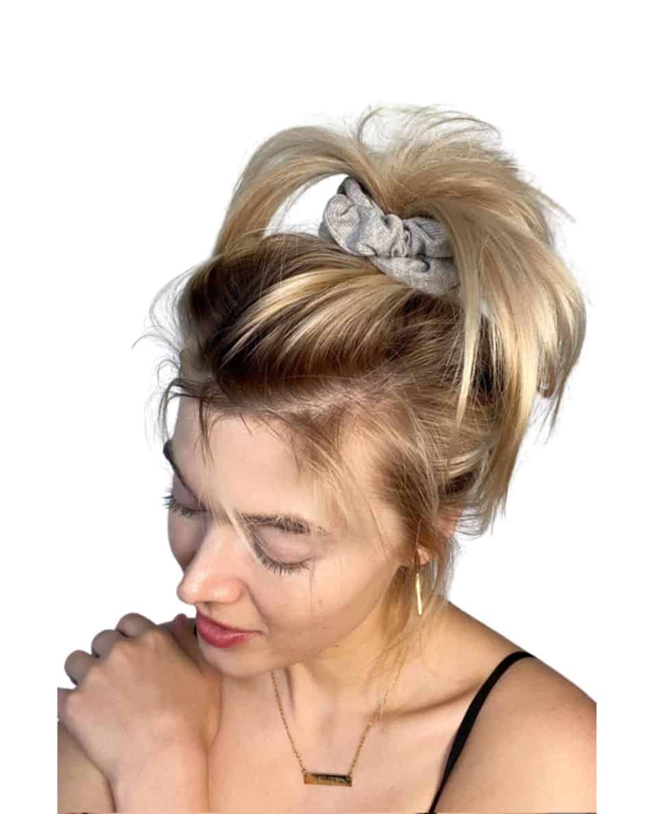 a woman with a scrunchie in her hair
