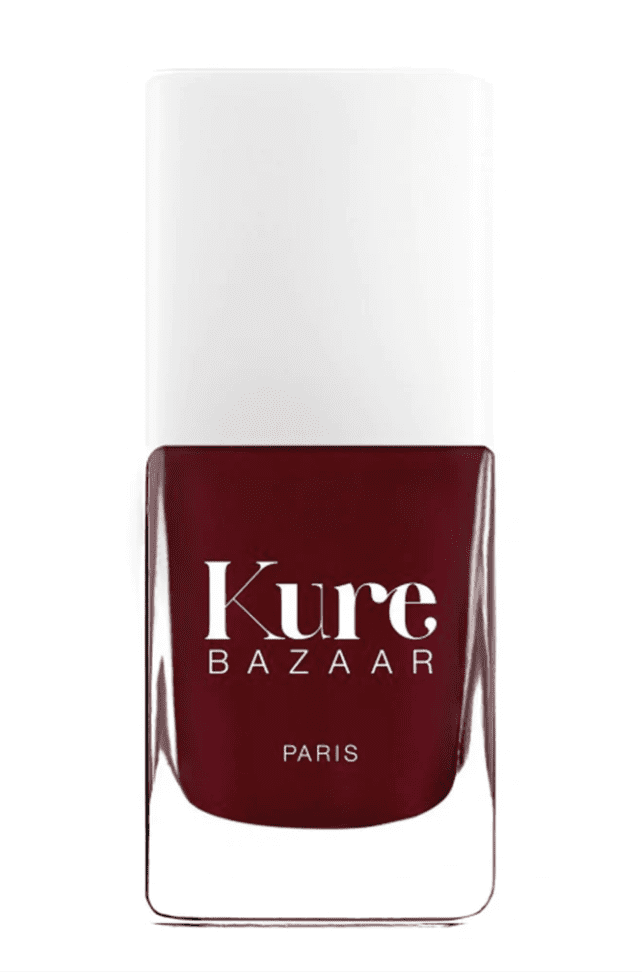 a bottle of kure bazaar nail polish in Parisienne color (a deep burgandy)