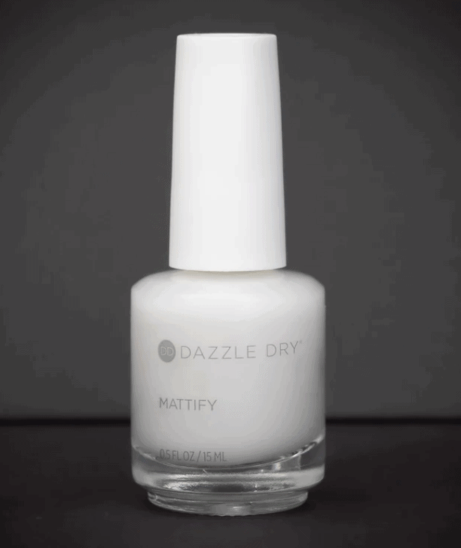 a bottle of dazzle dry mattify nail top coat