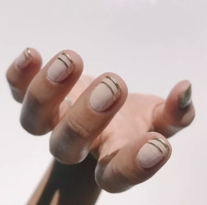 Cote No 13 and No 8 nail polishes on fingernails.