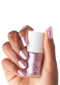 Olive & June Nail polish in Lilac shimmer painted onto finger nails.