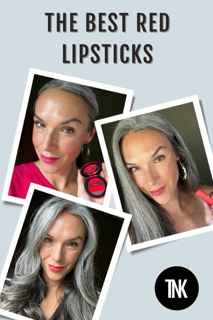 A woman shows different red lipsticks on her lips.
