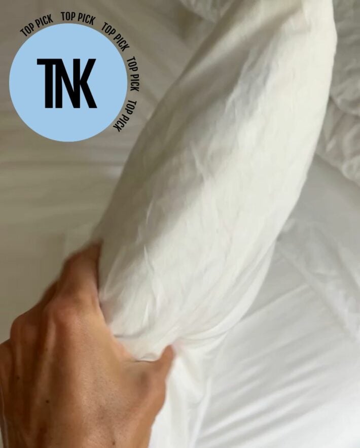 Side view of the Savvy Rest Organic Latex Soap-Shaped Pillow with TNK Top Pick Icon.