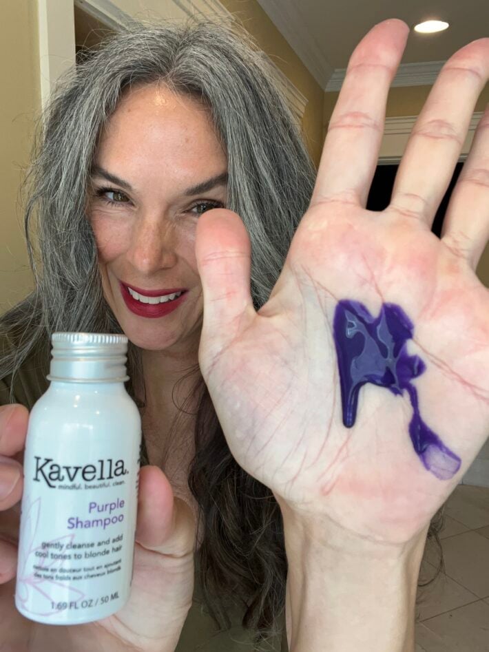 Kavella Purple Shampoo on a woman's hand.