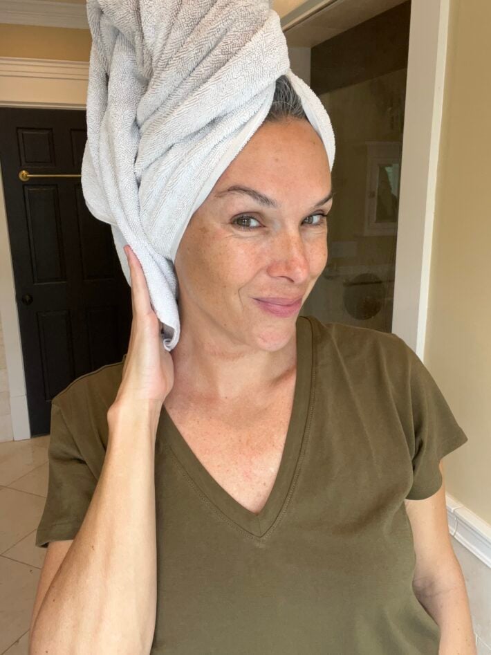 A woman with a towel on her head.