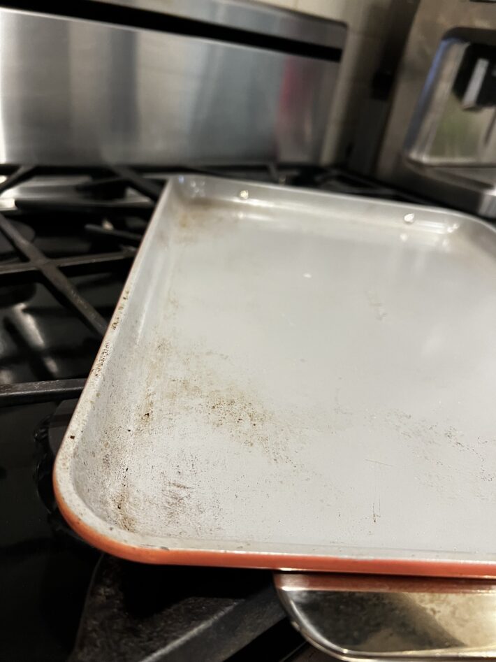 A Caraway Baking Sheet after a month of use.