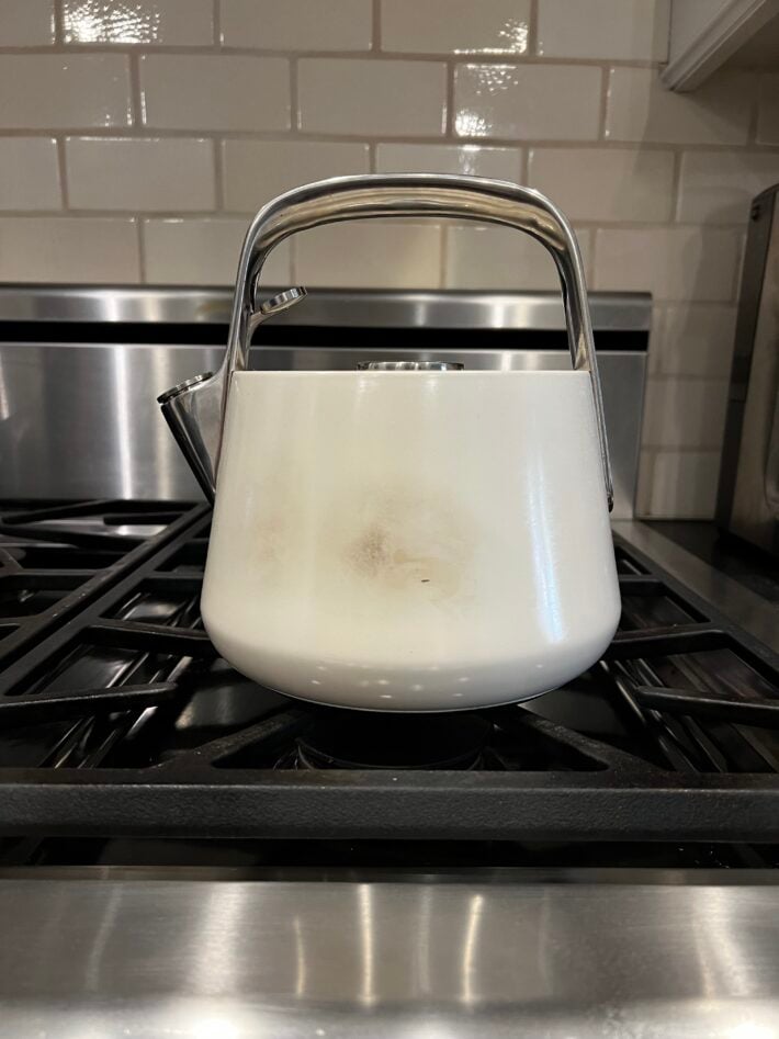 One side of the Caraway Tea Kettle showing tarnish.
