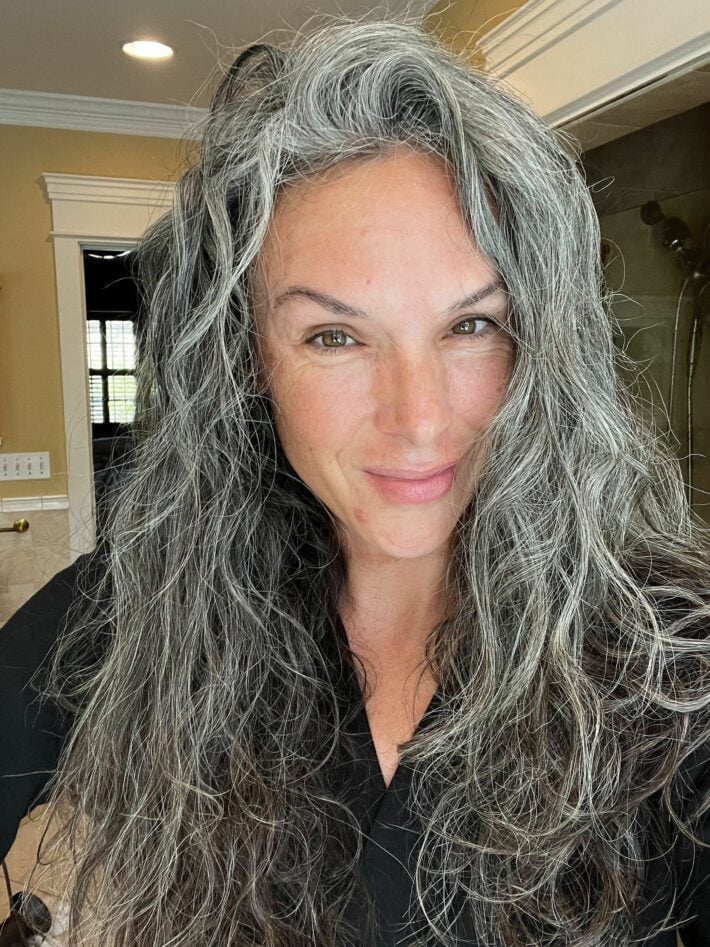 A woman with wavy gray hair