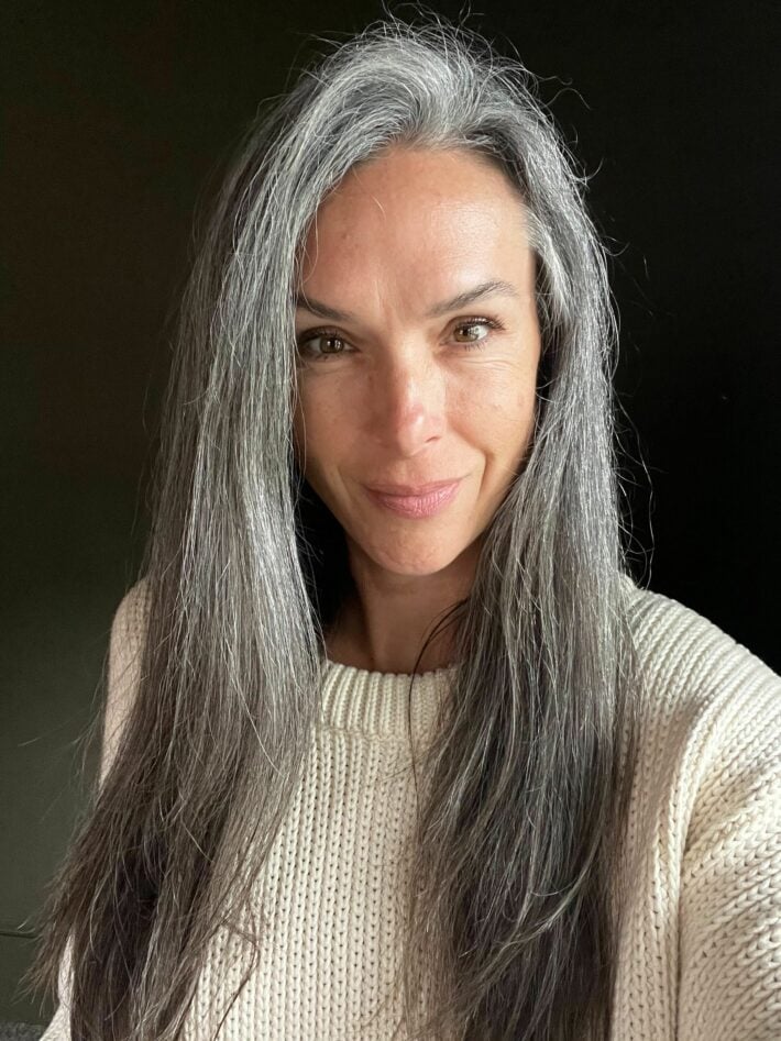 A woman with straight gray hair