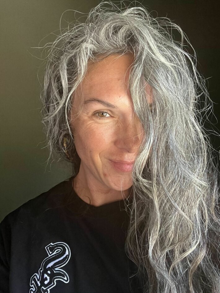 A woman with curly gray hair