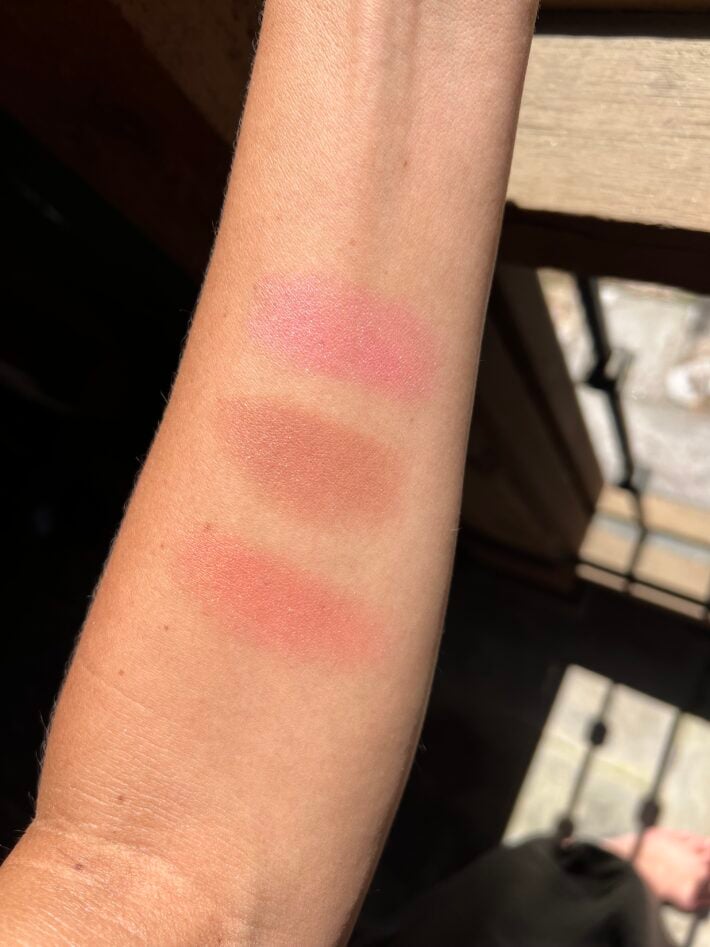 Swatches of RMS blush from top to bottom: French Rosé, Maiden’s Blush and Mai Tai on an arm.
