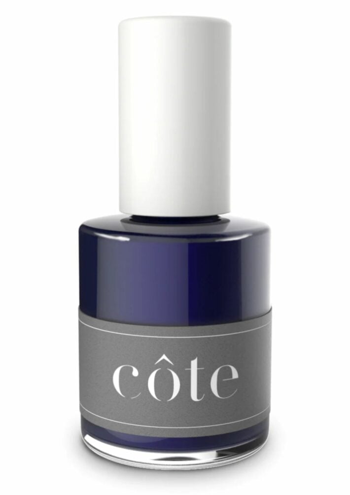 A bottle of Cote No. 76 Versatile Navy Blue nail polish.